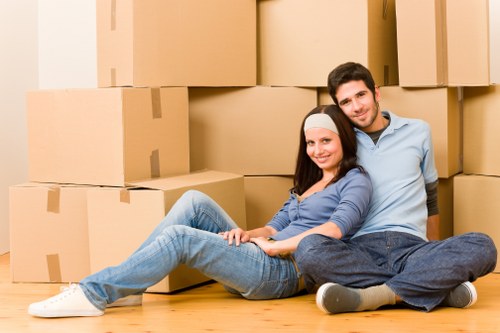 Local removals team handling furniture in a Kingston flat