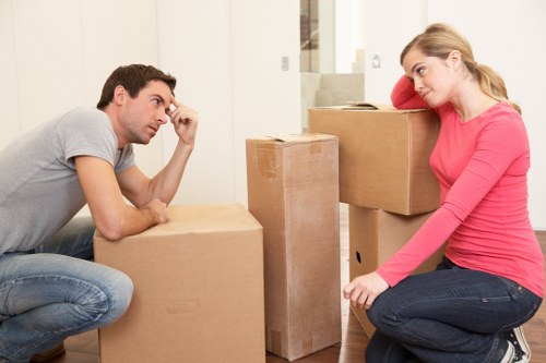 Staff assessing lifting risks before a house removal