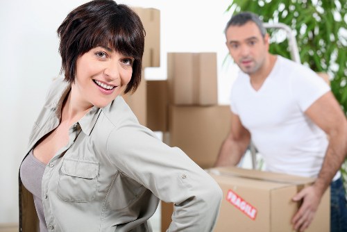 Professional apartment movers handling stairs and narrow access